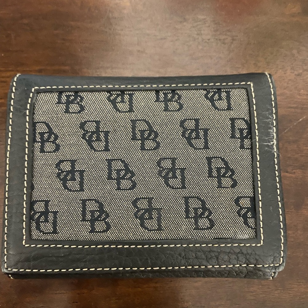 Dooney and Bourke trifold wallet with change storage